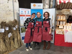 Three volunteers helping at the Scotland The Bread market stall